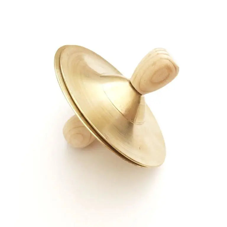 Golden spinning top with a smooth, rounded shape.