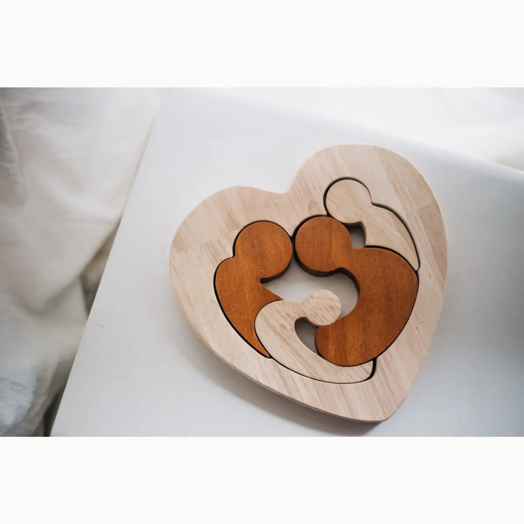 Heart-shaped wooden family puzzle.