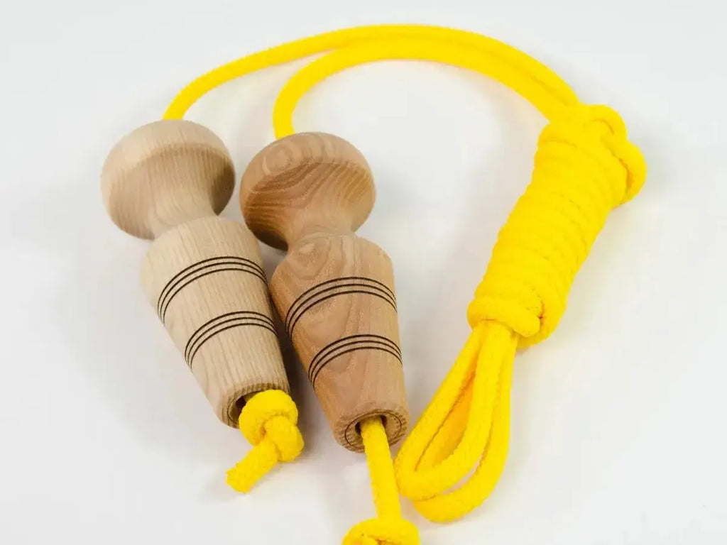 Yellow jump rope with wooden handles.