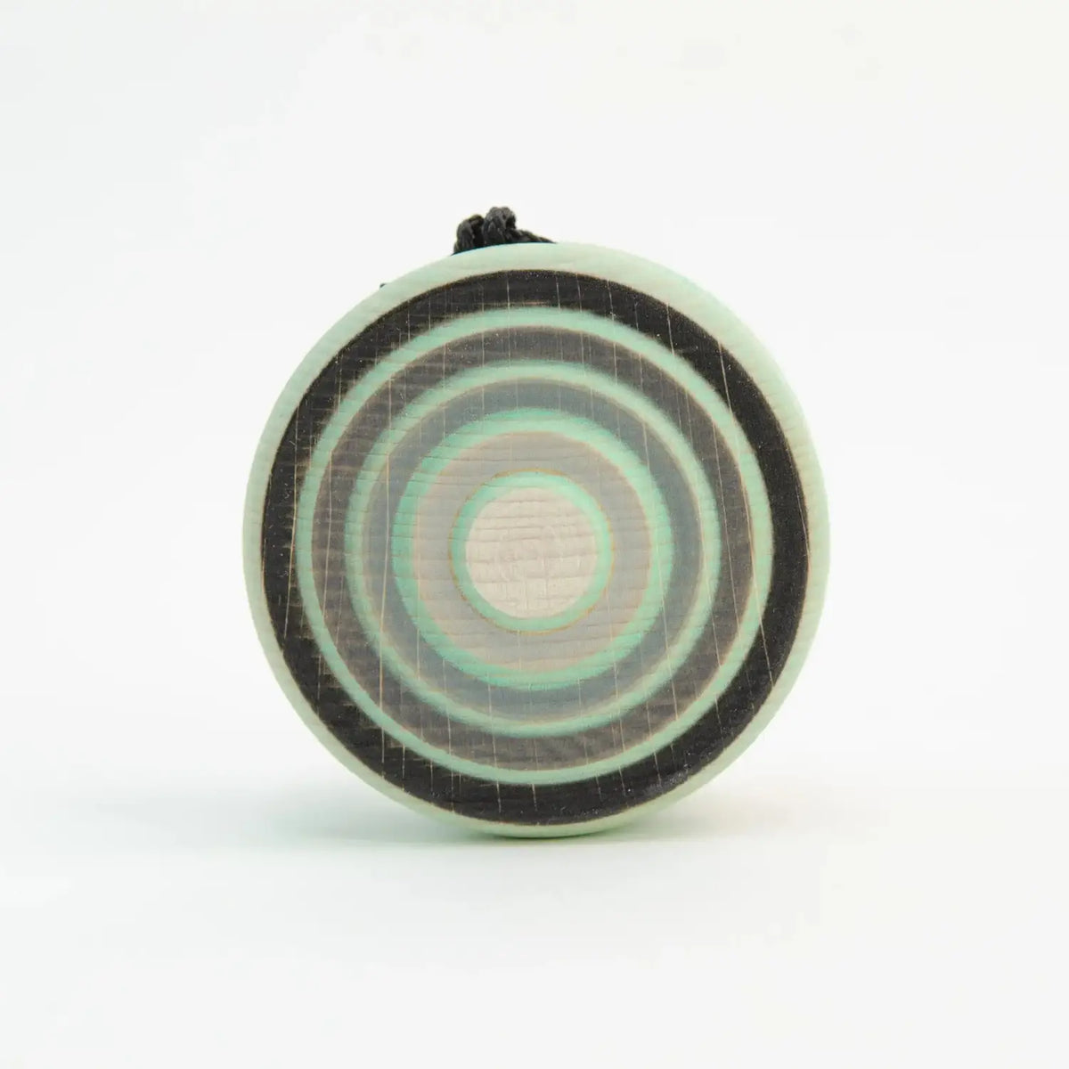 Circular pendant with concentric rings.