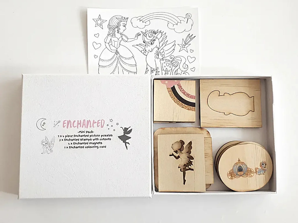 Wooden stamp set with fairy tale-themed designs in a box labeled ’Enchanted’.