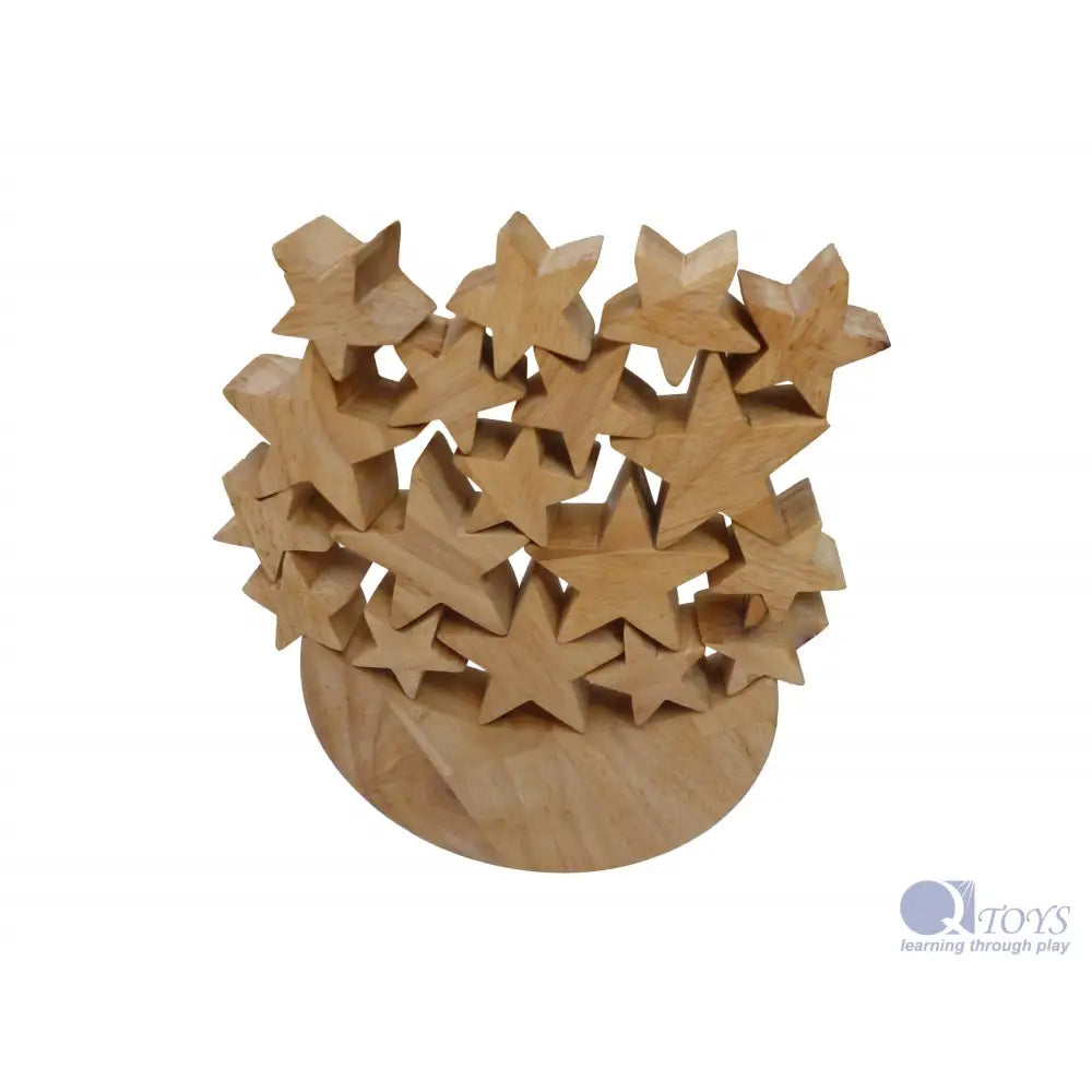Wooden sculpture featuring multiple star shapes arranged in a cluster.