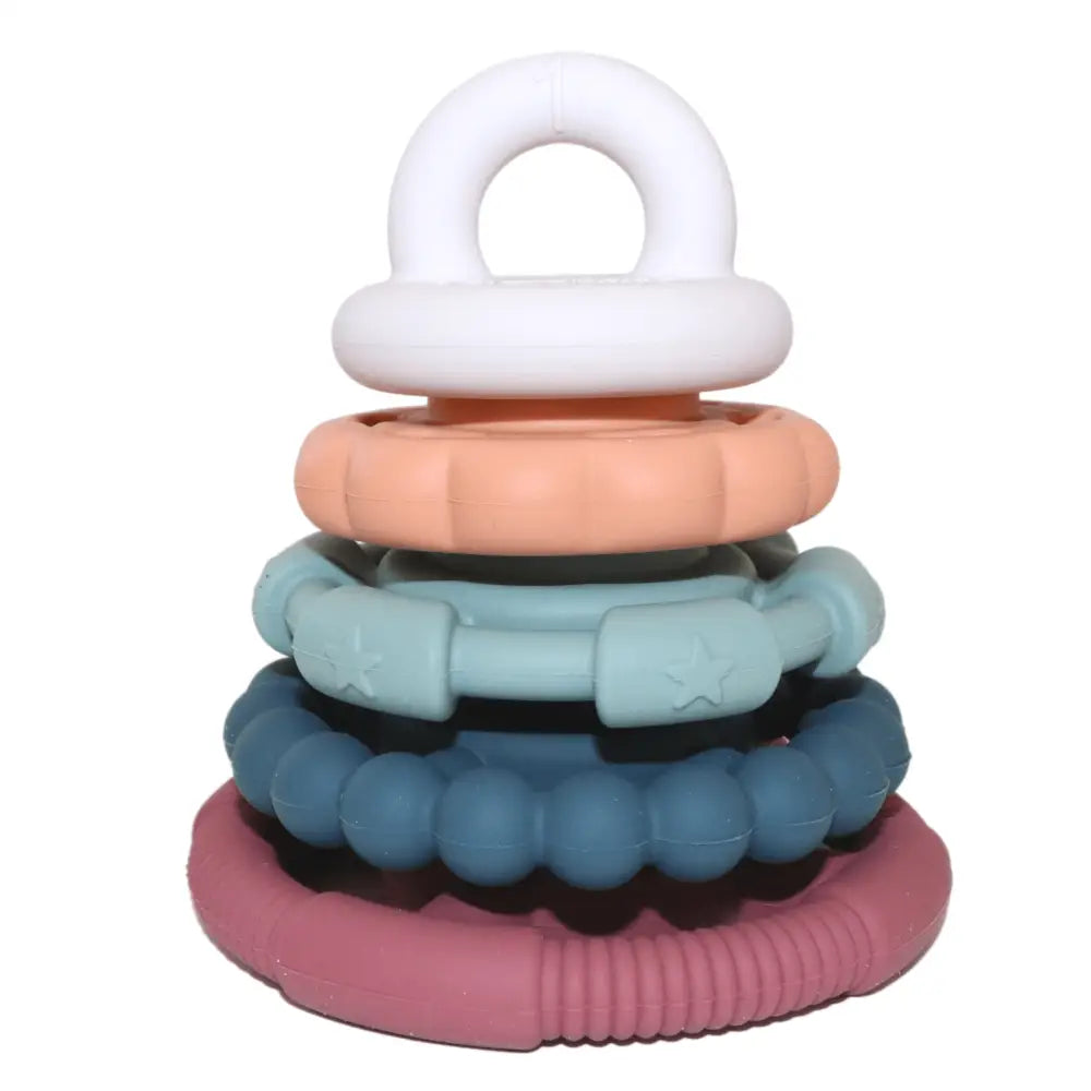 Colorful stacking toy with rings in pastel shades and a white loop on top.
