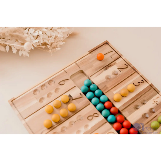 Wooden counting board with colorful beads arranged in rows.
