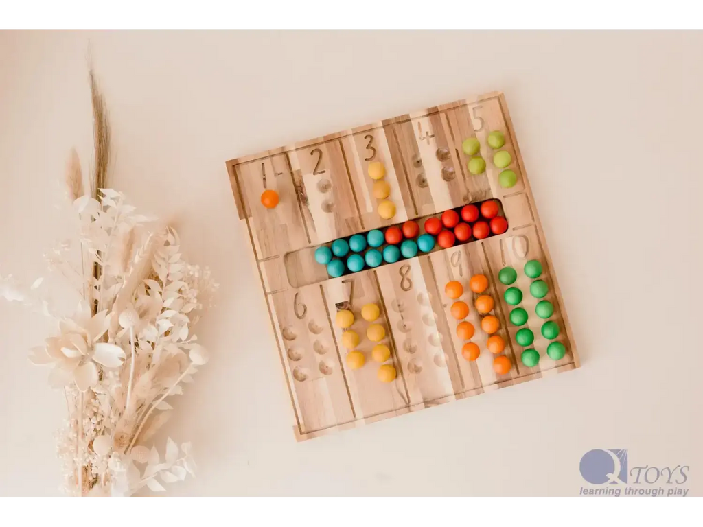 Wooden counting board with colorful beads arranged in rows next to numbers.
