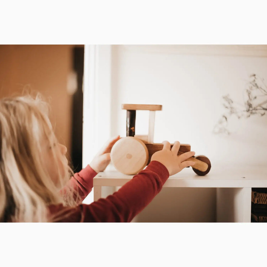 Wooden toy tractor.