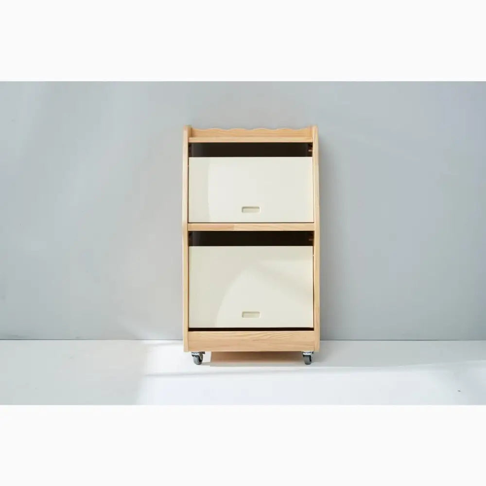 Wooden storage unit with two fabric-covered drawers on wheels.