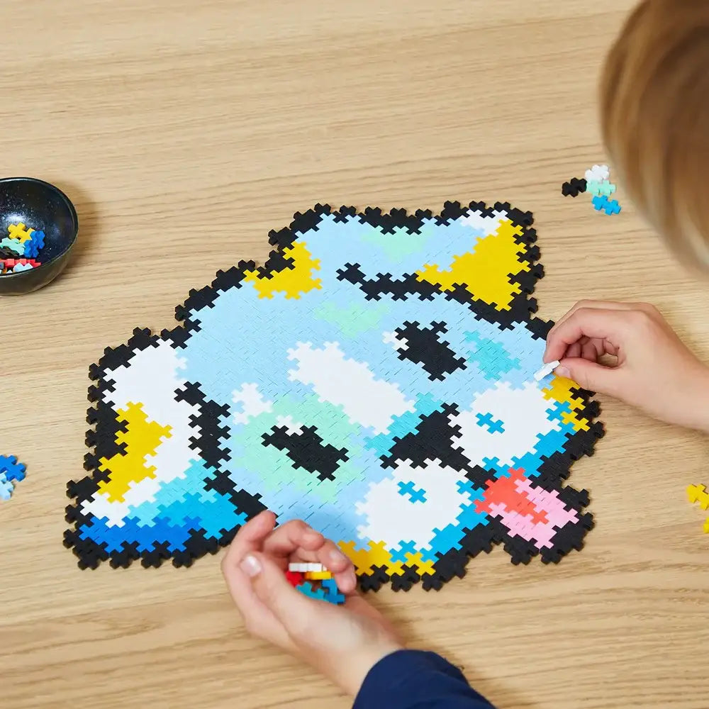Pixel art puzzle of a blue cartoon fish character being assembled.