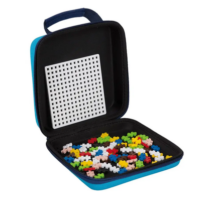 Carrying case containing colorful plastic building blocks and a perforated board.