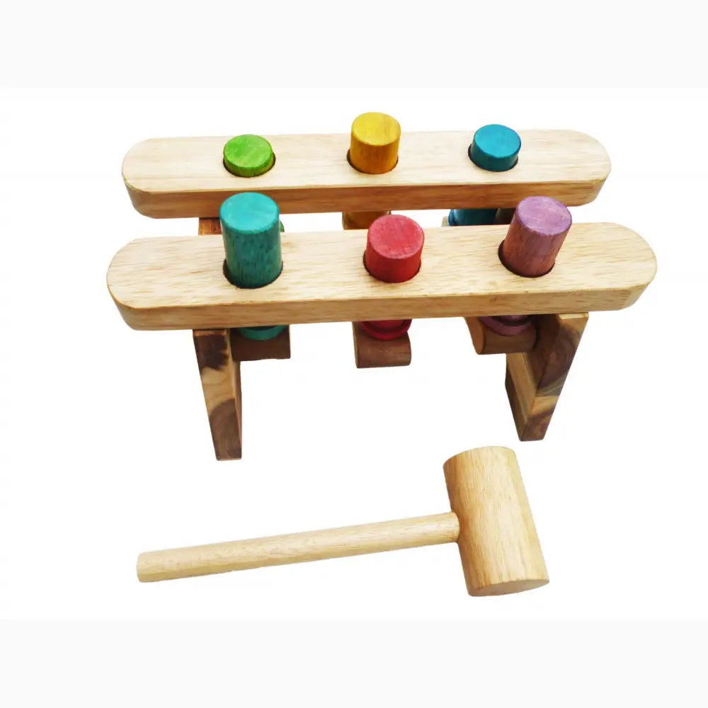 Wooden toy hammer game with colorful pegs on a two-tiered platform.