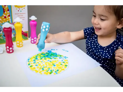 Child using colorful dot markers to create a circular pattern on paper.
