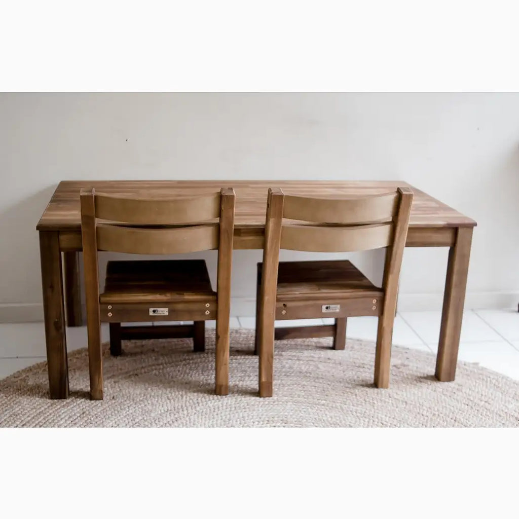 Wooden dining table with two chairs.