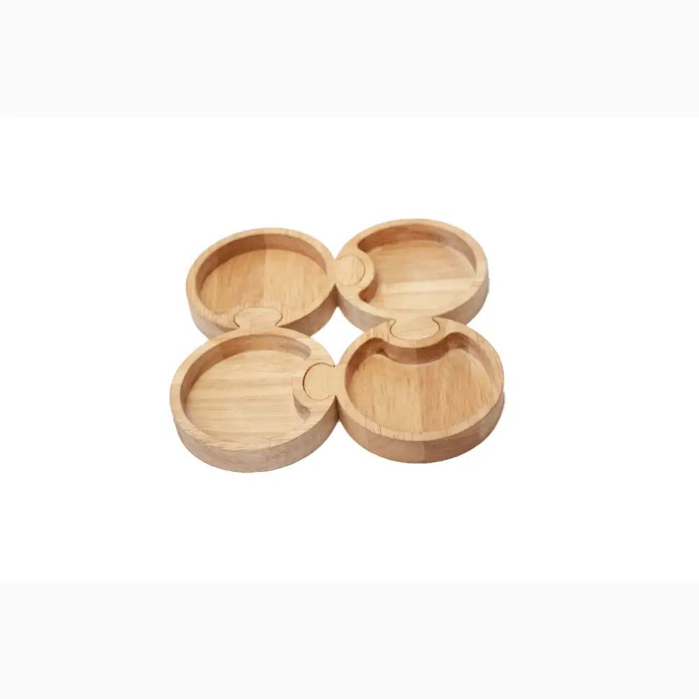 Set of four interconnected wooden coasters with circular indentations.