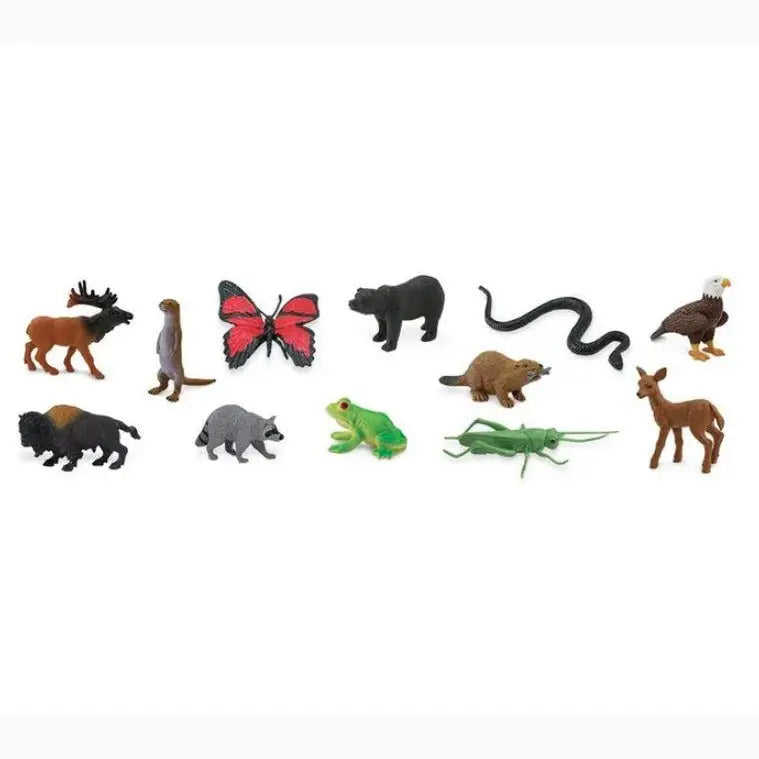 Collection of small plastic animal and insect figurines representing various species.