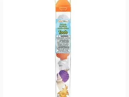 Clear plastic tube containing small toy dinosaur figures with an orange cap.