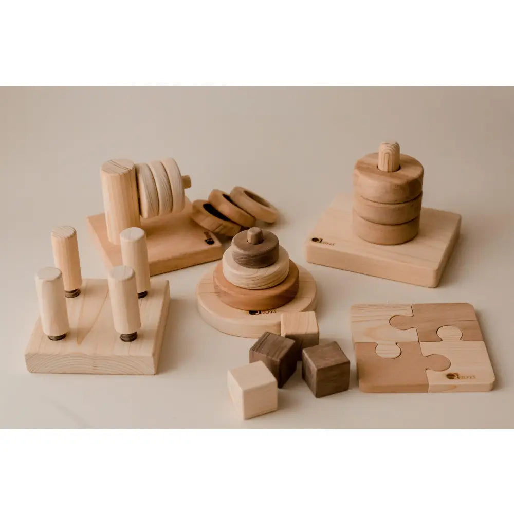 Collection of wooden educational toys and puzzles for children.