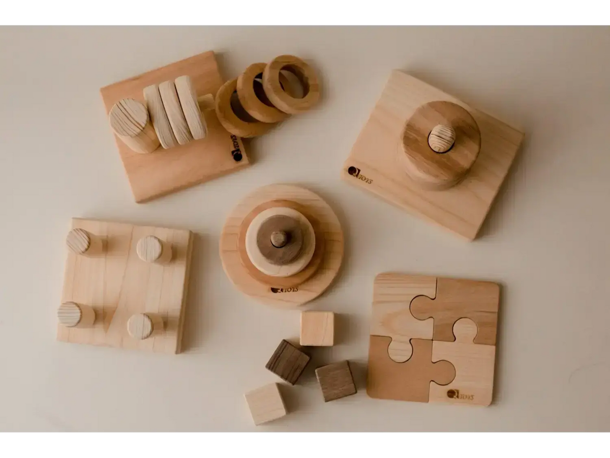 Collection of wooden toys and educational objects for children.