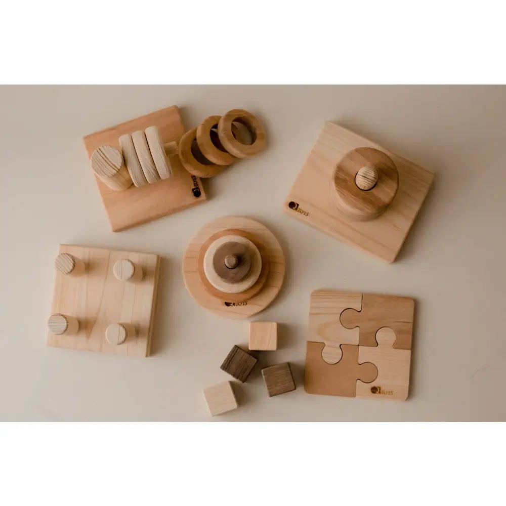 Collection of wooden toys and educational objects for children.