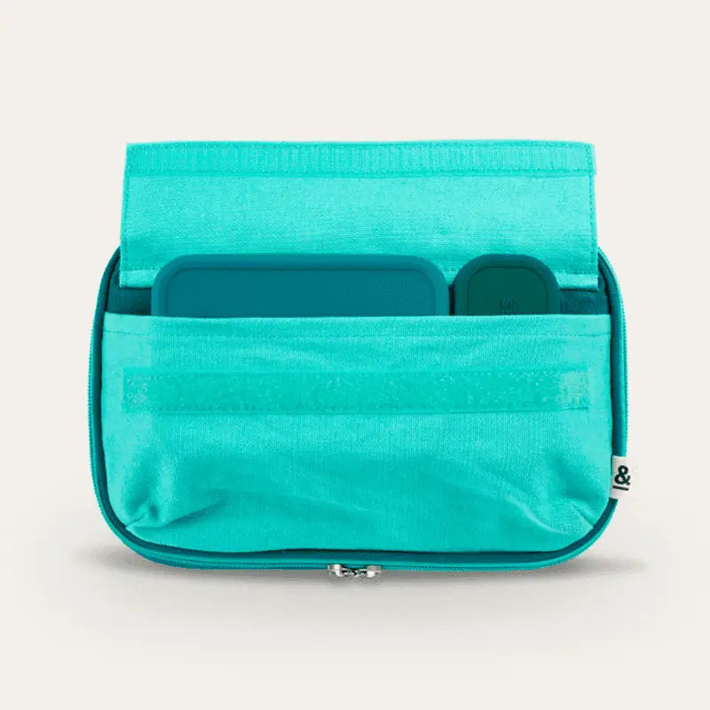 Turquoise fabric organizer with multiple pockets and a zipper closure.