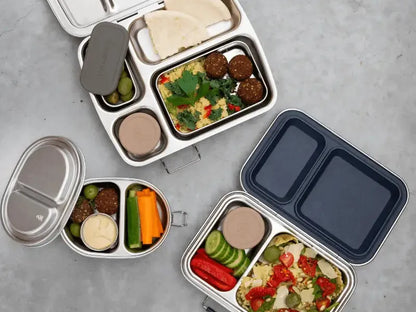Assortment of bento boxes or lunch containers filled with various foods.