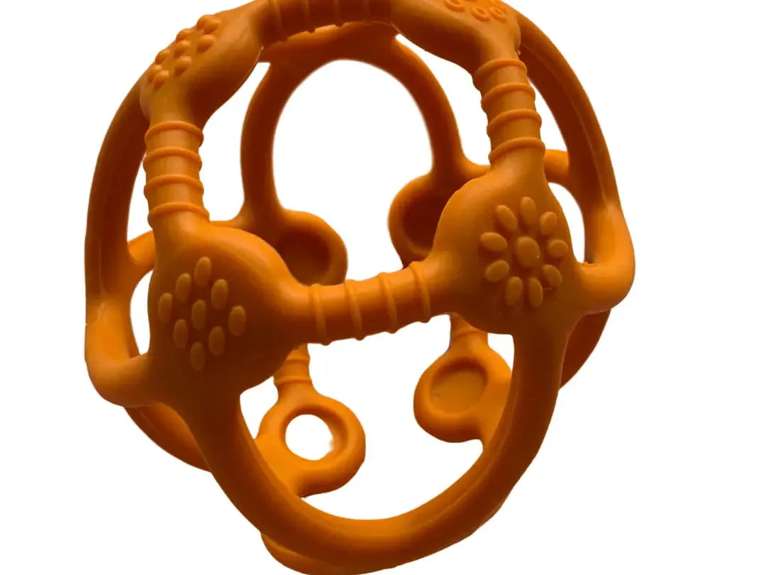 Orange teething toy with various textured shapes and loops.