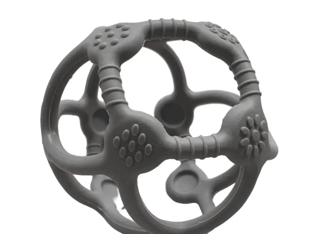 Gray spherical teething toy with various textured surfaces and openings.