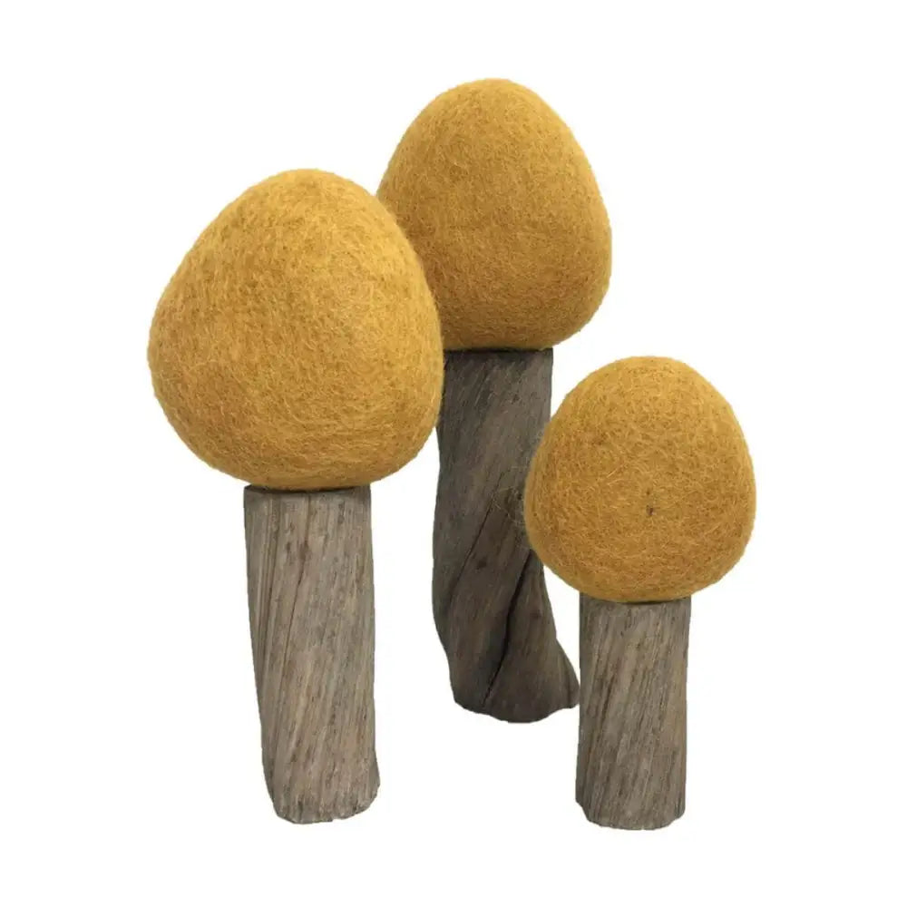 Decorative mushroom-shaped objects with yellow felt caps on wooden stems.