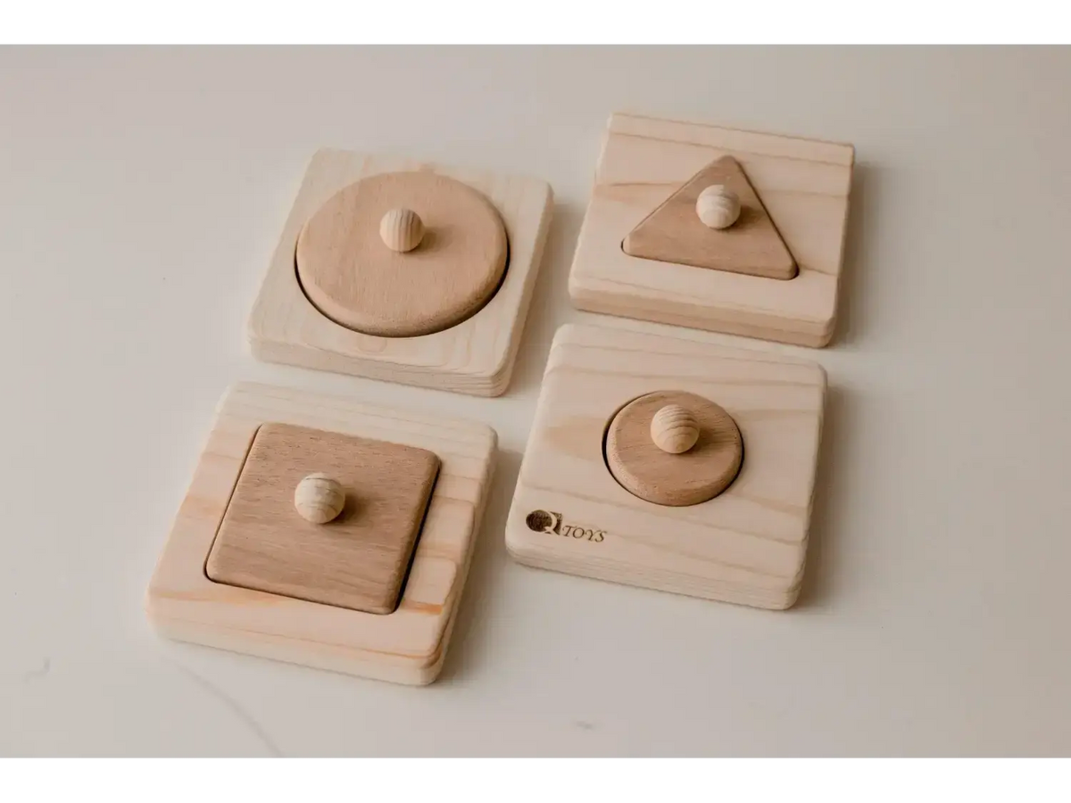 Set of wooden shape puzzles for children featuring circles, squares, and triangles.
