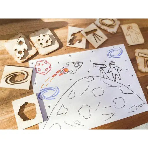 Drawing of a space scene featuring planets, rockets, and an astronaut on a moon’s surface.