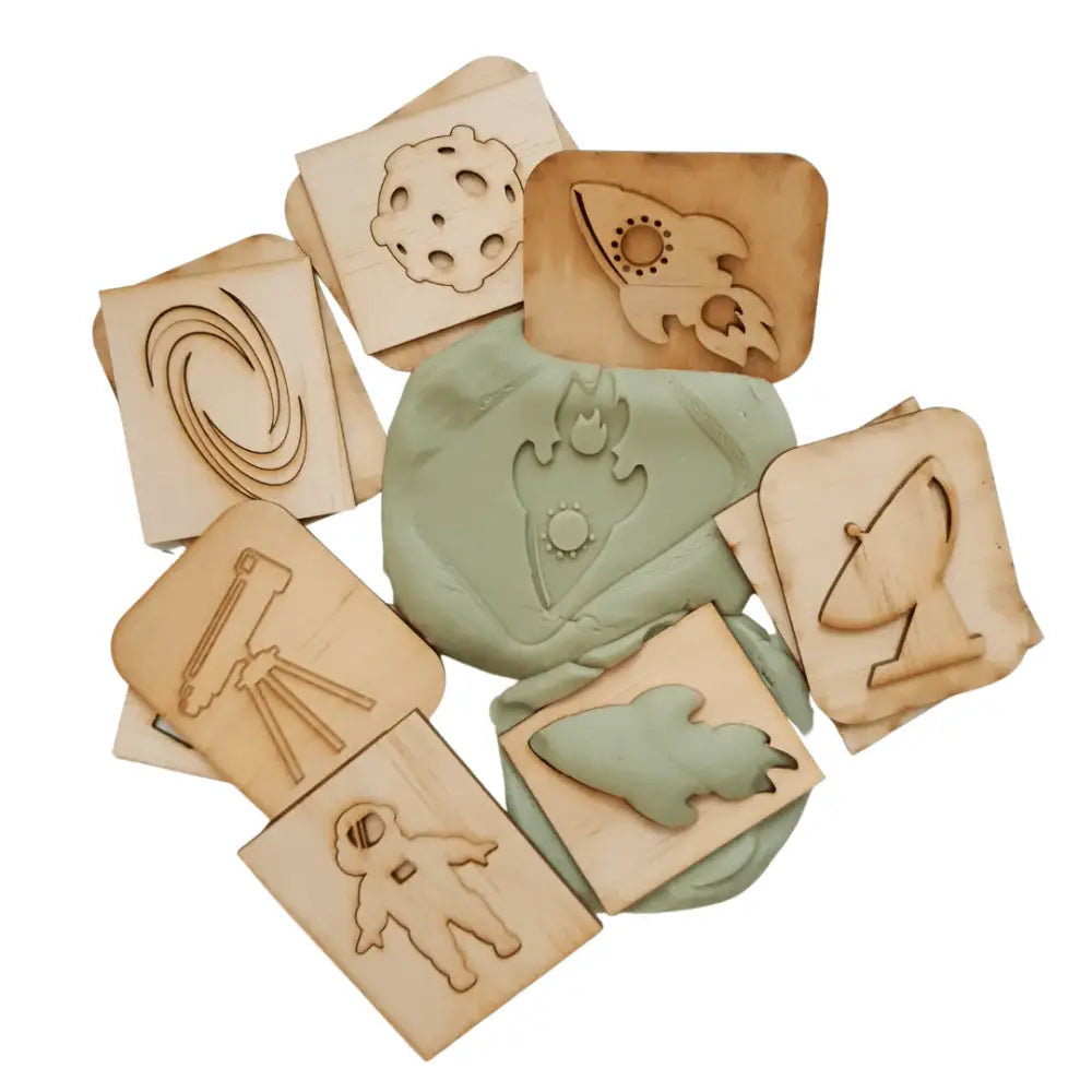 Collection of wooden and clay tiles with various carved or imprinted designs.