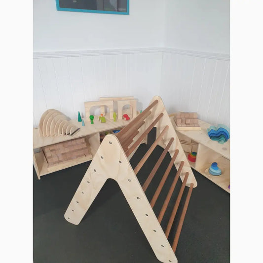 Wooden climbing triangle with rungs for children’s play and development.