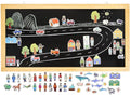 Chalkboard with a road scene and various magnetic pieces to create a town or community layout.