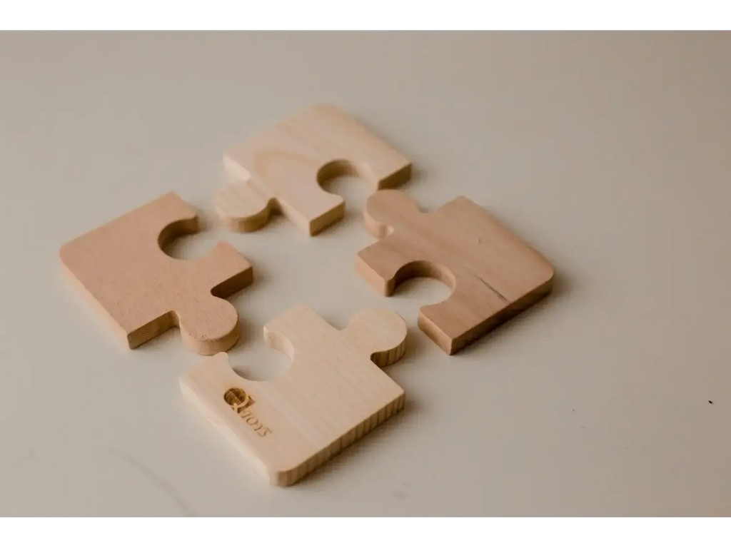Puzzle pieces in a beige or light tan color.