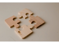Puzzle pieces in a beige or light tan color.