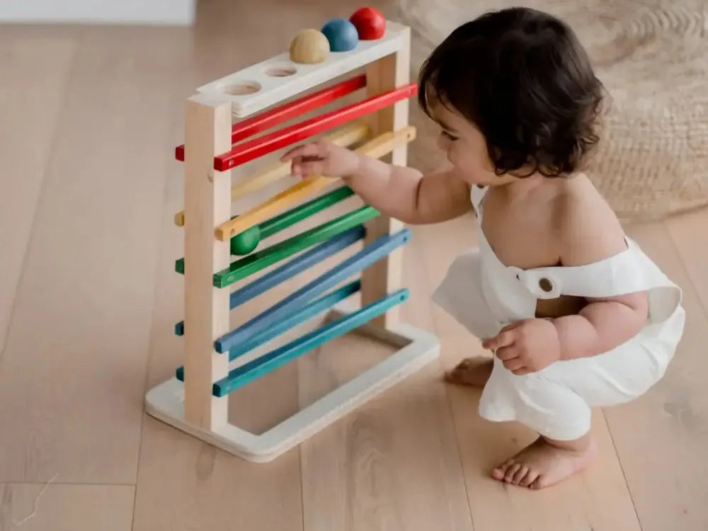 Wooden educational toy with colorful sliding beads on horizontal rods.