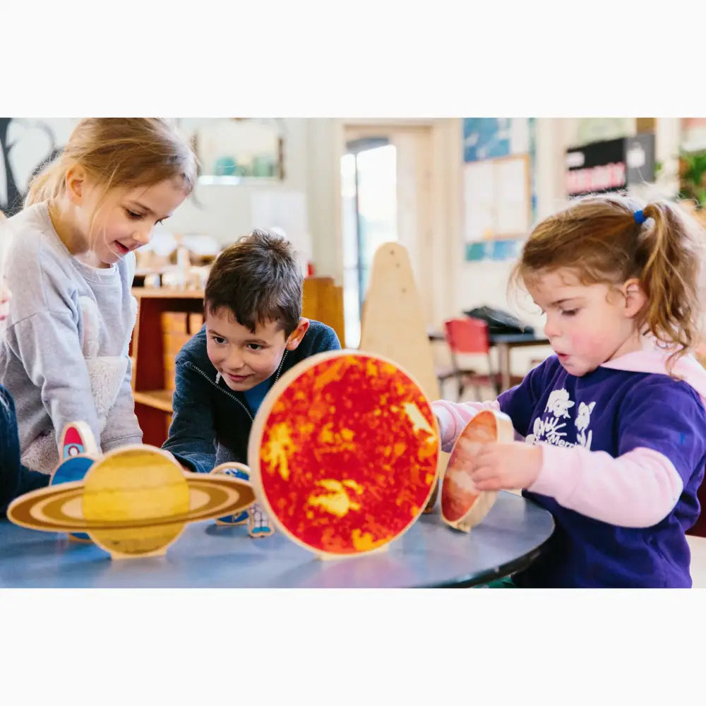 Model of the solar system with colorful planet representations.