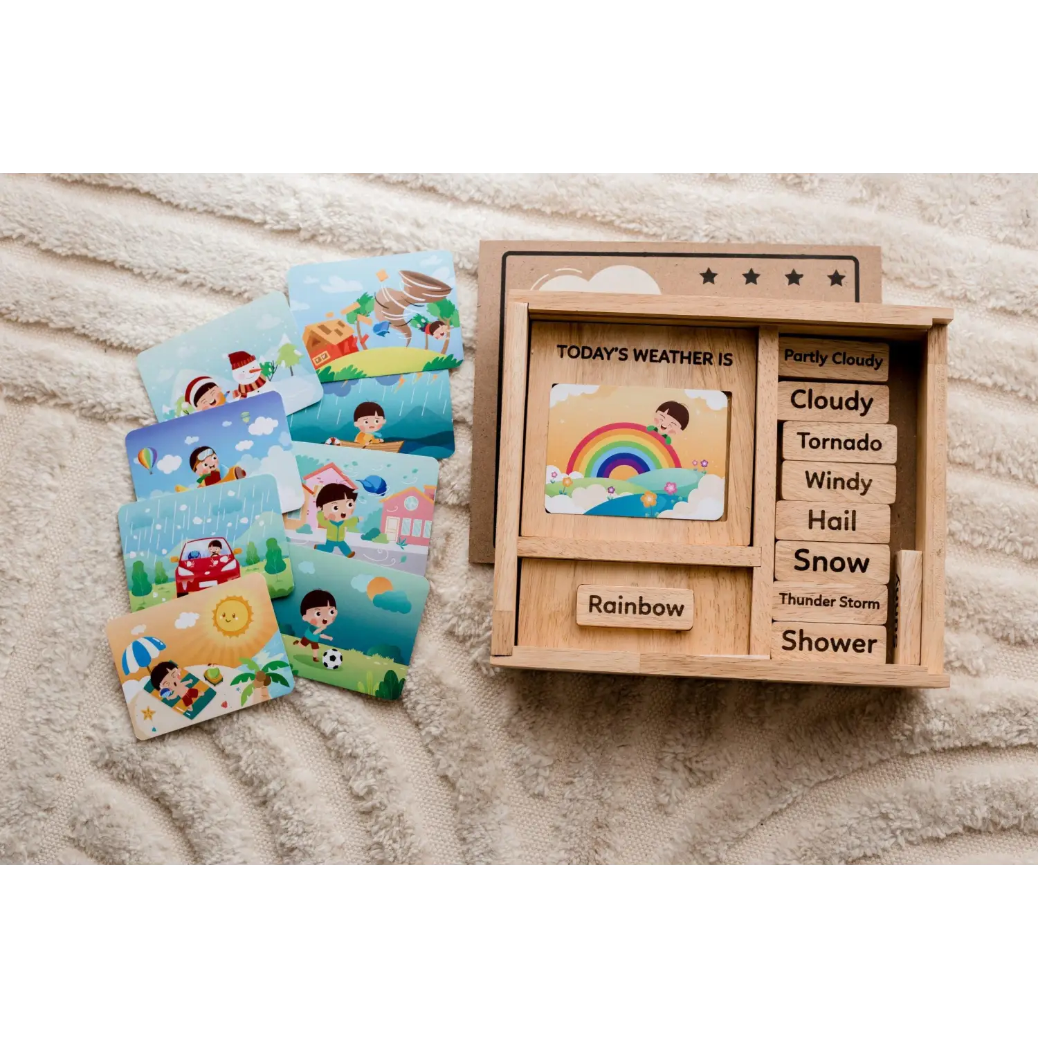 Wooden weather learning toy with interchangeable picture cards depicting various weather conditions.