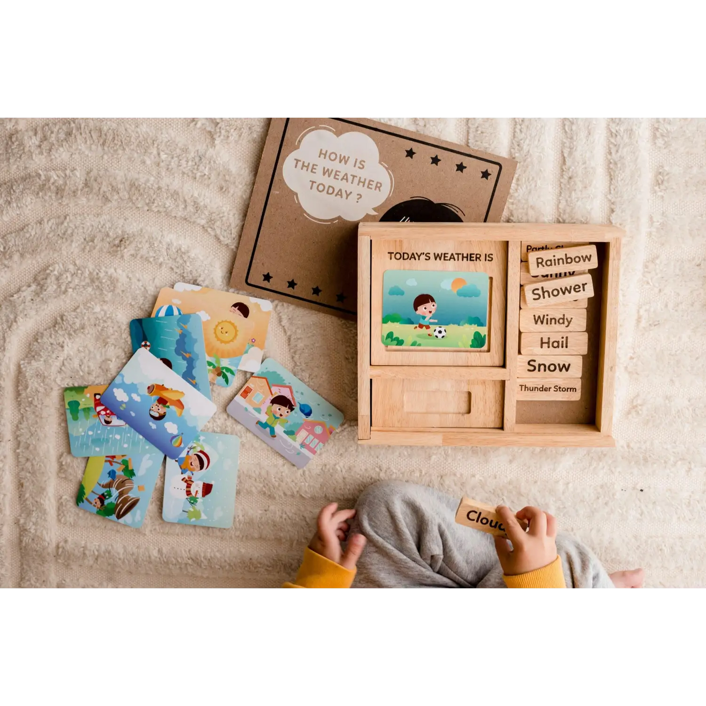 Wooden weather learning toy with interchangeable cards and a display board.