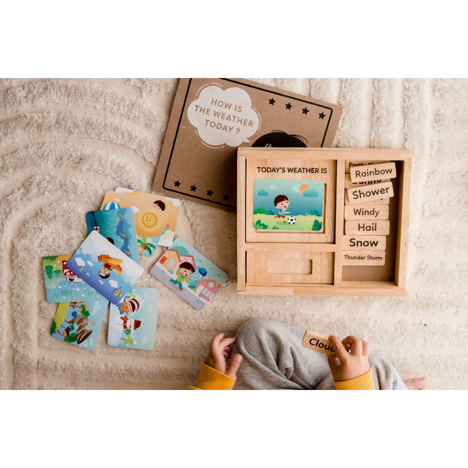Wooden weather learning toy with interchangeable cards and a display board.