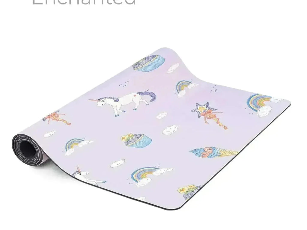 Yoga mat with a whimsical unicorn and rainbow pattern on a light purple background.