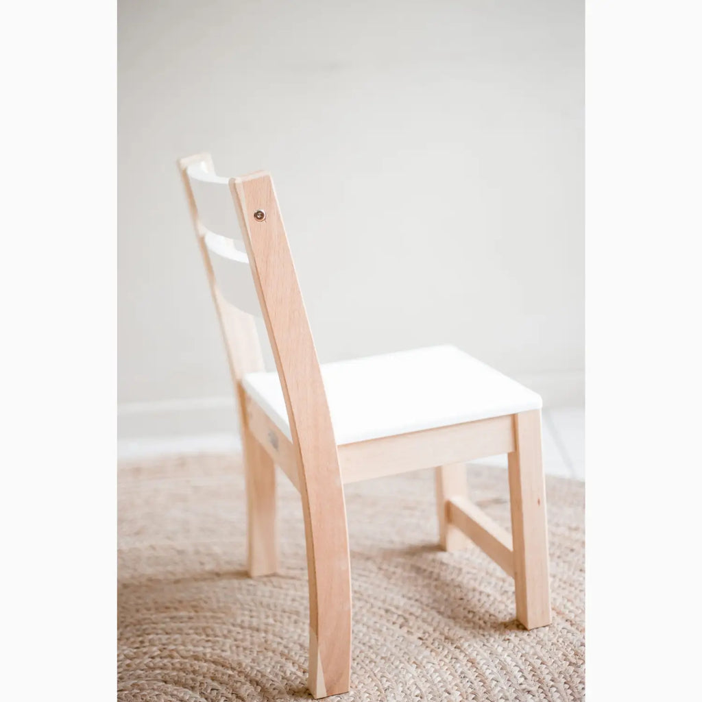 Wooden chair with white seat.