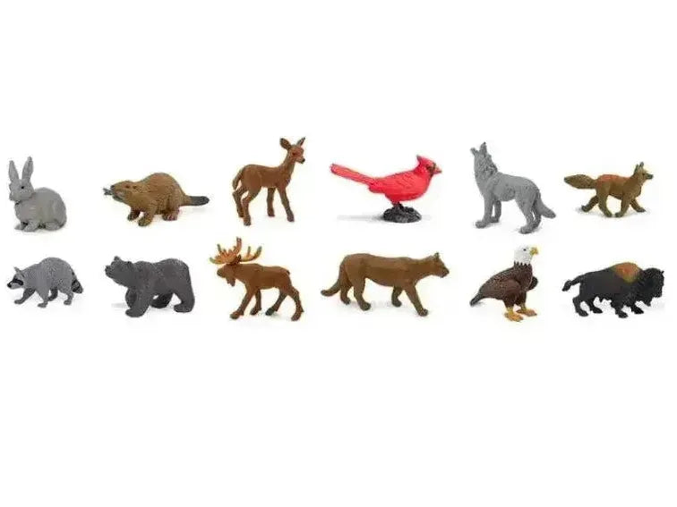 Collection of miniature animal figurines representing various North American wildlife species.