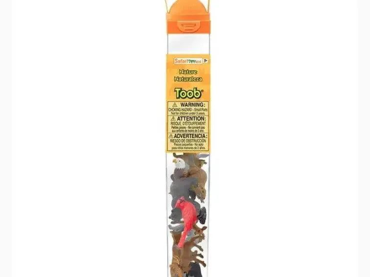 Transparent tube containing small plastic animal figurines with an orange cap and handle.