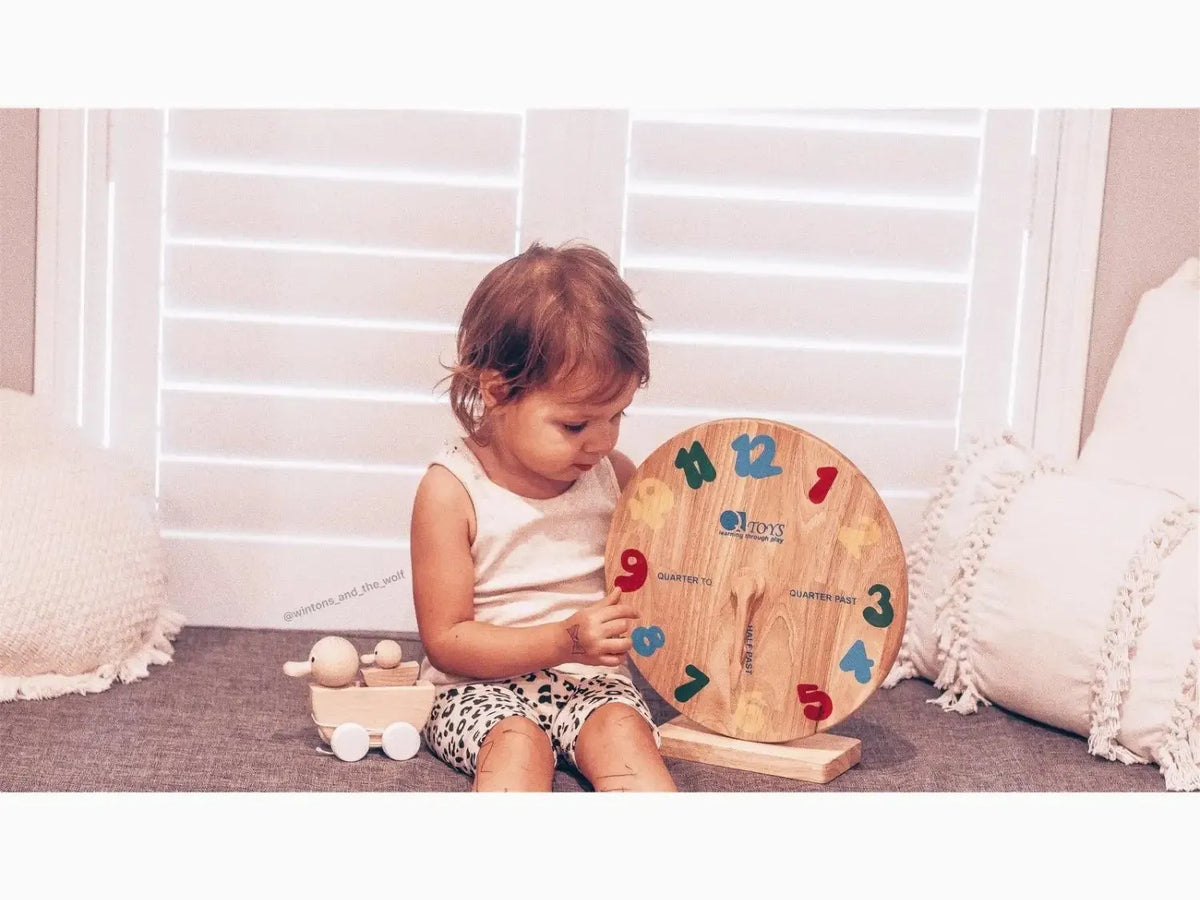 Wooden clock learning toy.