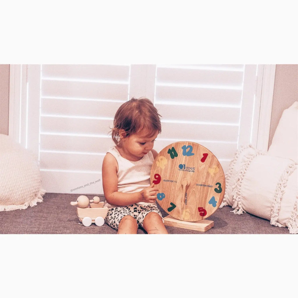 Wooden clock learning toy.