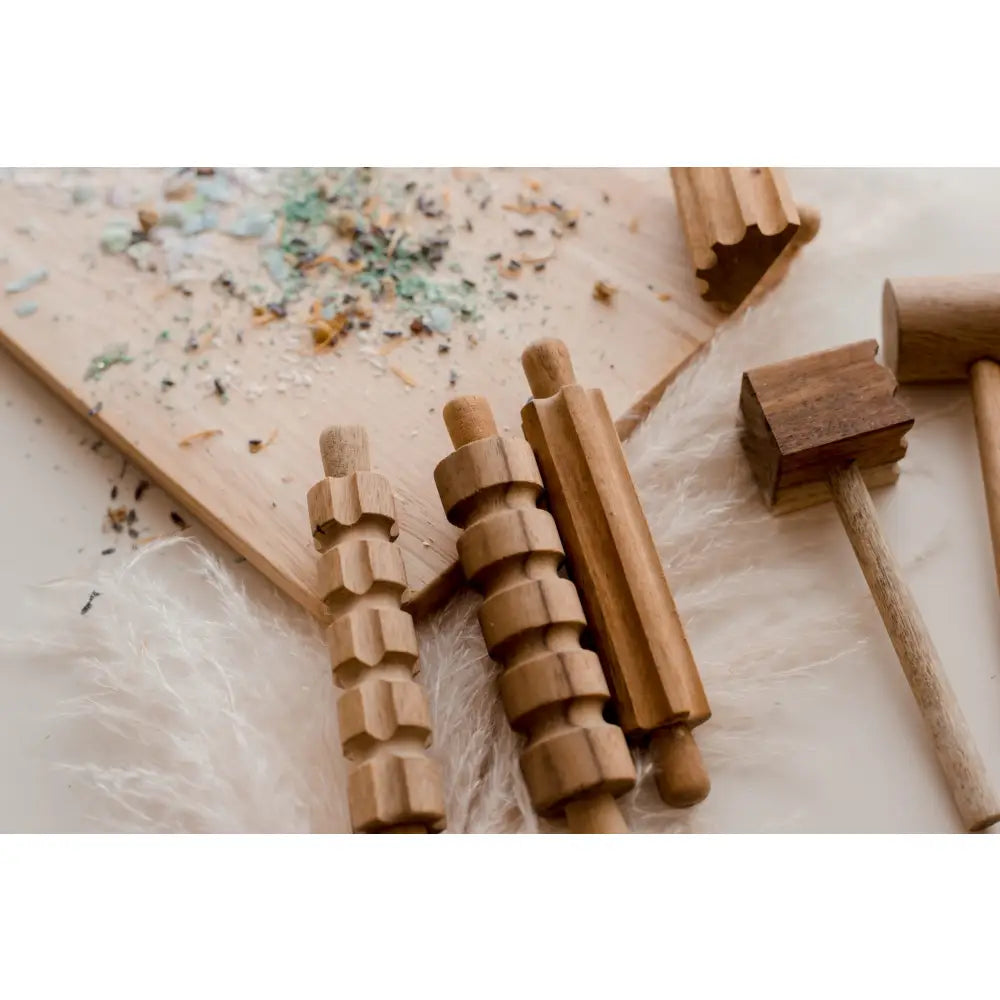Wooden massage tools or rollers with ridged surfaces.