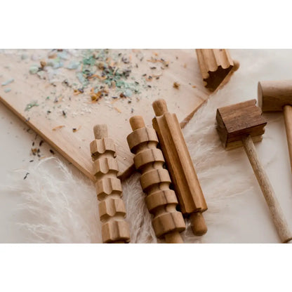 Wooden massage tools or rollers with ridged surfaces.