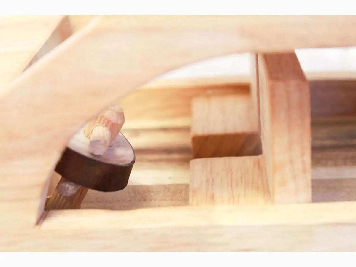 Wooden mallet or hammer with a round head.