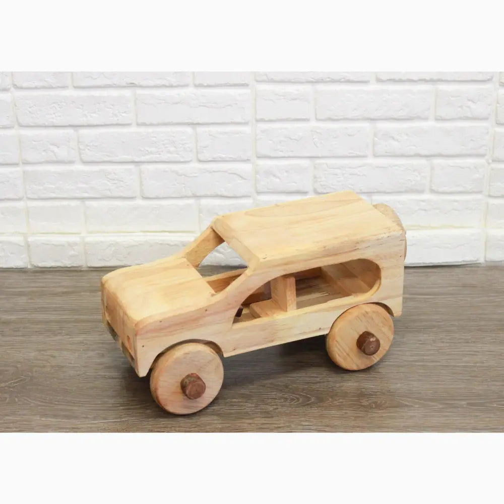 Wooden toy car with rounded edges and circular wheels.